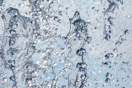 abstract figure of a water fountain on blurred backgroundの写真素材