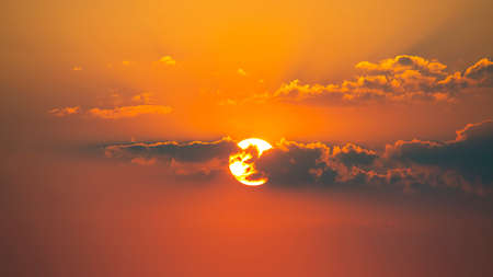 Colorful sunset in the evening sky. The nature and beauty of cloudsの写真素材