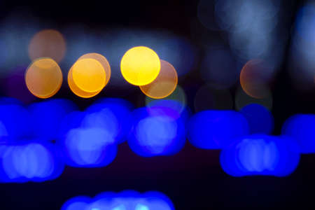 Colored blurred bokeh. abstract background of included festive garlands. colorful blur light bulbsの写真素材