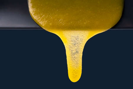 Fresh flower honey flows down from the plate. vitamin organic food