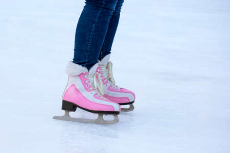 legs of a woman ice skating on an ice rink. hobbies and leisure. winter sportsの写真素材