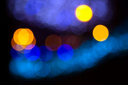 Colored blurred bokeh. abstract background of included festive garlands. colorful blur light bulbs