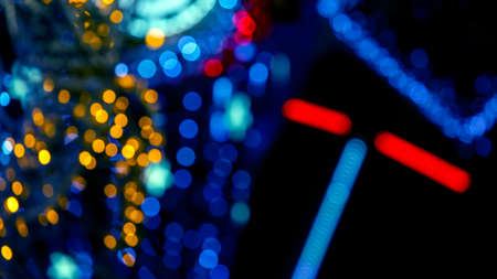 background blurred abstraction of colored lanterns and decorations. bokeh texture of street colored...