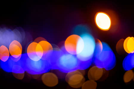 background blurred abstraction of colored lanterns and decorations. bokeh texture of street colored lightsの写真素材