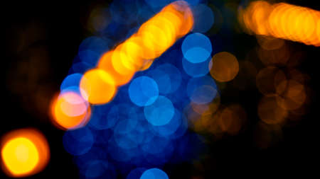 background blurred abstraction of colored lanterns and decorations. bokeh texture of street colored lightsの写真素材