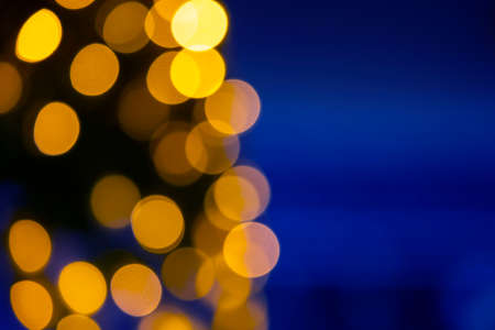 background blurred abstraction of colored lanterns and decorations. bokeh texture of street colored...