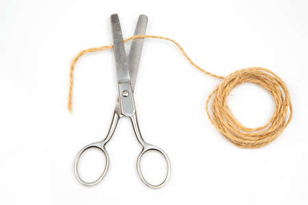 cutting scissors and thread rope isolated on white background