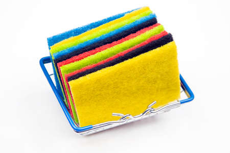 colored samples of felt material in a basket on a white backgroundの写真素材