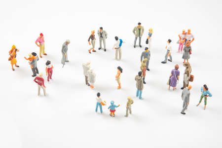 miniature people. different people communicate with each other on a white backgroundの写真素材