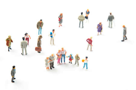 miniature people. different people communicate with each other on a white backgroundの写真素材