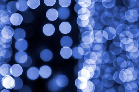 background blurred abstraction of colored lanterns and decorations. bokeh texture of street colored...