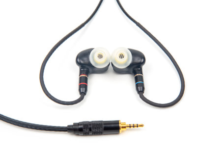 In-ear headphones for Hi-Fi music player. Audio sound and modern equipment for music lovers and audiophilesの写真素材