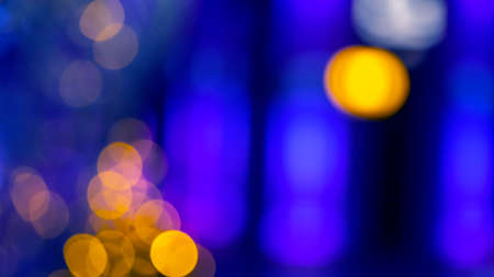 background blurred abstraction of colored lanterns and decorations. bokeh texture of street colored lightsの写真素材