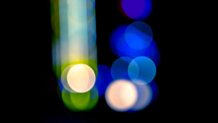 background blurred abstraction of colored lanterns and decorations. bokeh texture of street colored...