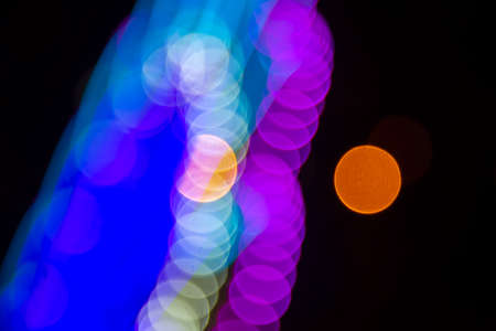 background blurred abstraction of colored lanterns and decorations. bokeh texture of street colored lightsの写真素材