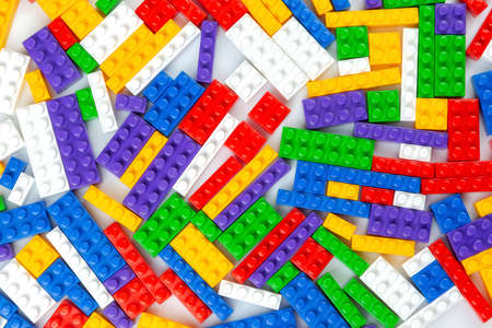 Abstract background texture of colored constructor blocks. Background of colorful plastic part of...
