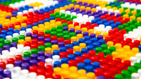 Abstract background texture of colored constructor blocks. Background of colorful plastic part of...