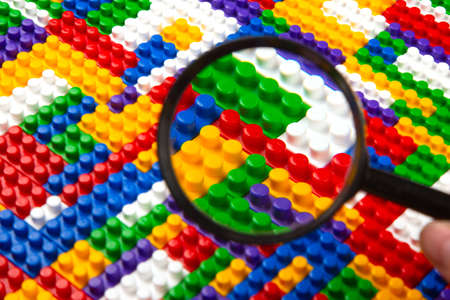 Abstract background texture of colored constructor blocks. Background of colorful plastic part of...