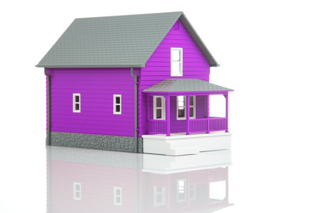 small model of an apartment building on a white backgroundの写真素材