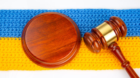gavel of justice on the background of the Ukrainian flagの写真素材