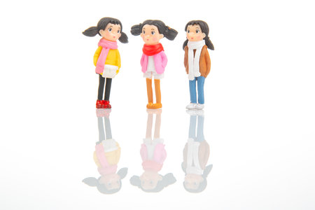 miniature people. figures for the game. cute girlfriends together on white backgroundの写真素材