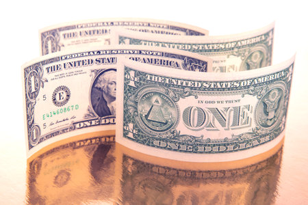 labyrinth of dollars on a golden background. financial wall of success. business concept