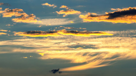 the expressive contrast of the clouds in the sky and sun. The nature and beauty of cloudsの写真素材