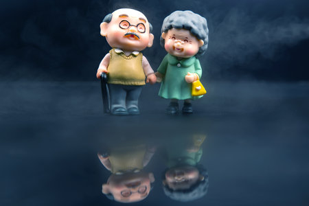 miniature people. figures for the concept. a couple of pensioners walk together. attitude and friendship in old ageの写真素材