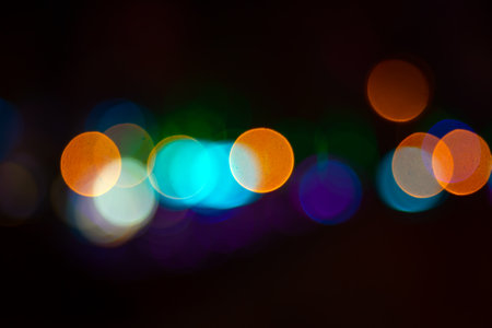 background blurred abstraction of colored lanterns and decorations. bokeh texture of street colored...