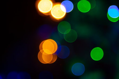 background blurred abstraction of colored lanterns and decorations. bokeh texture of street colored lightsの写真素材