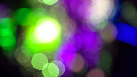 background blurred abstraction of colored lanterns and decorations. bokeh texture of street colored lightsの写真素材