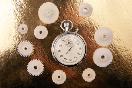 mechanical analog stopwatch on a colored background. Time part precision. Measurement of the speed...