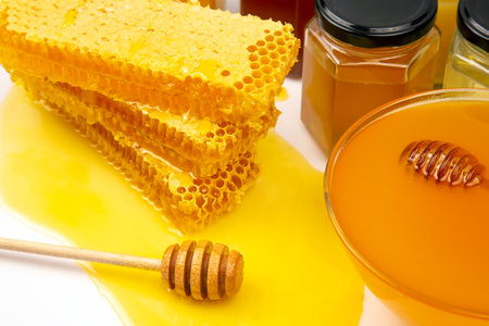 Hexagonal jars with different types and colors of fresh flower honey. vitamin food for health and lifeの写真素材