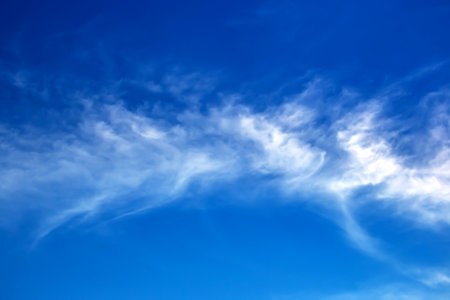 the expressive contrast of the clouds in the skyの写真素材