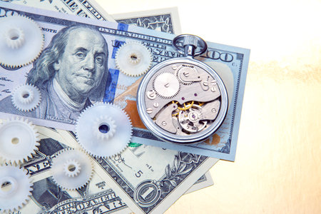 mechanical stopwatch on the background of dollars. Part time accuracy for business. business and finance time.の写真素材