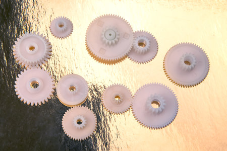 white plastic gears. connection mechanism details. subject of movementの写真素材