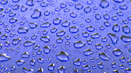 Drops of water on a colored background. abstract textureの写真素材