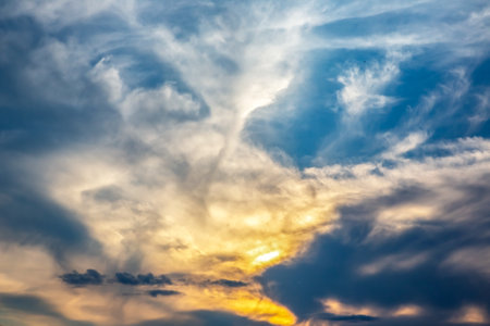 brightly colorful clouds in the evening sky. Lush colored clouds in the sky before sunsetの写真素材