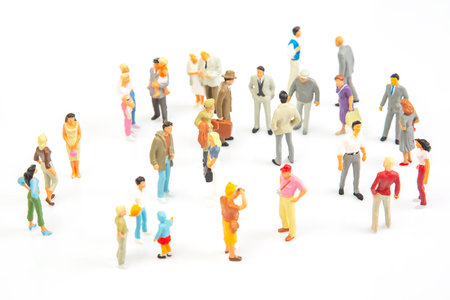 miniature people. group of different people communicate with each other on a white background. concept of communications and relations in society.の写真素材