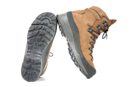 Trekking boots for hiking on a white background. Equipment for travel and hiking