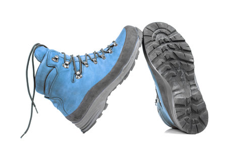 Trekking boots for hiking on a white background. Equipment for travel and hikingの写真素材