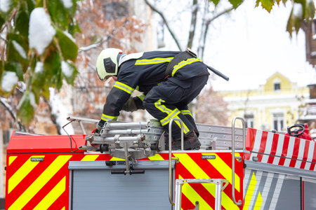 firefighter man works on his fire truck. fire safety service
