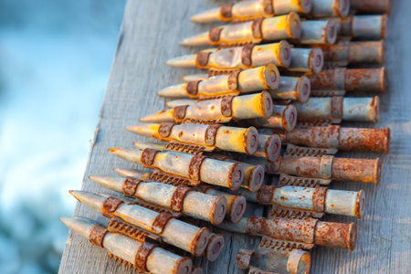 old rusty cartridges in a machine-gun belt. war in Ukraine. military ammunitionの写真素材