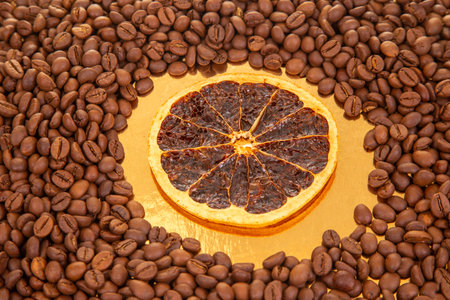 A sensory delight featuring dried orange segments layered over rich coffee beans. coffee aroma and taste descriptorsの写真素材