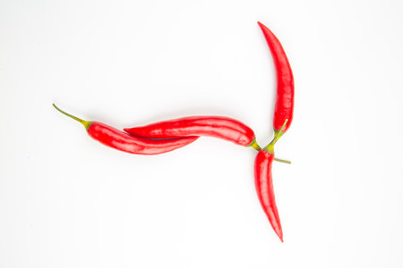 Red hot chili peppers on a white background. Vitamin vegetable foodの写真素材