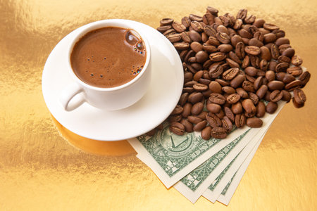 Rich Turkish coffee in a white cup is featured with coffee beans and dollar bills on a shimmering gold background, symbolizing wealth and tasteの写真素材