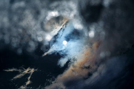 the reflection of the sun and clouds in the sky