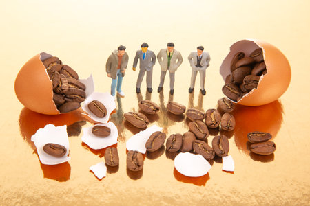 A surreal still life with tiny people in suits and casual wear near broken orange eggs filled with...