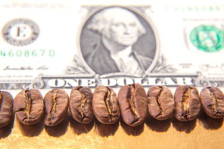 Macro shot of roasted coffee beans resting on a US dollar bill, blending finance and coffee culture...