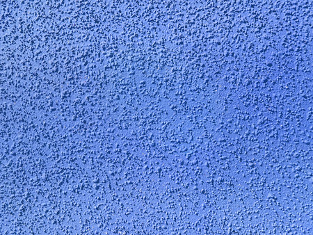 Subtle patterns create a textured ceiling surface that reflects light in a bright room. The tranquil blue hue enhances the airy atmosphere, suggesting a calming interior design choice.の写真素材